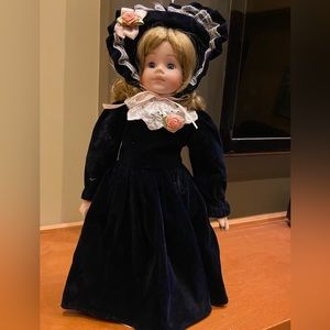 Porcelains doll. Porcelain head, arms & legs. Soft body. On a removable …